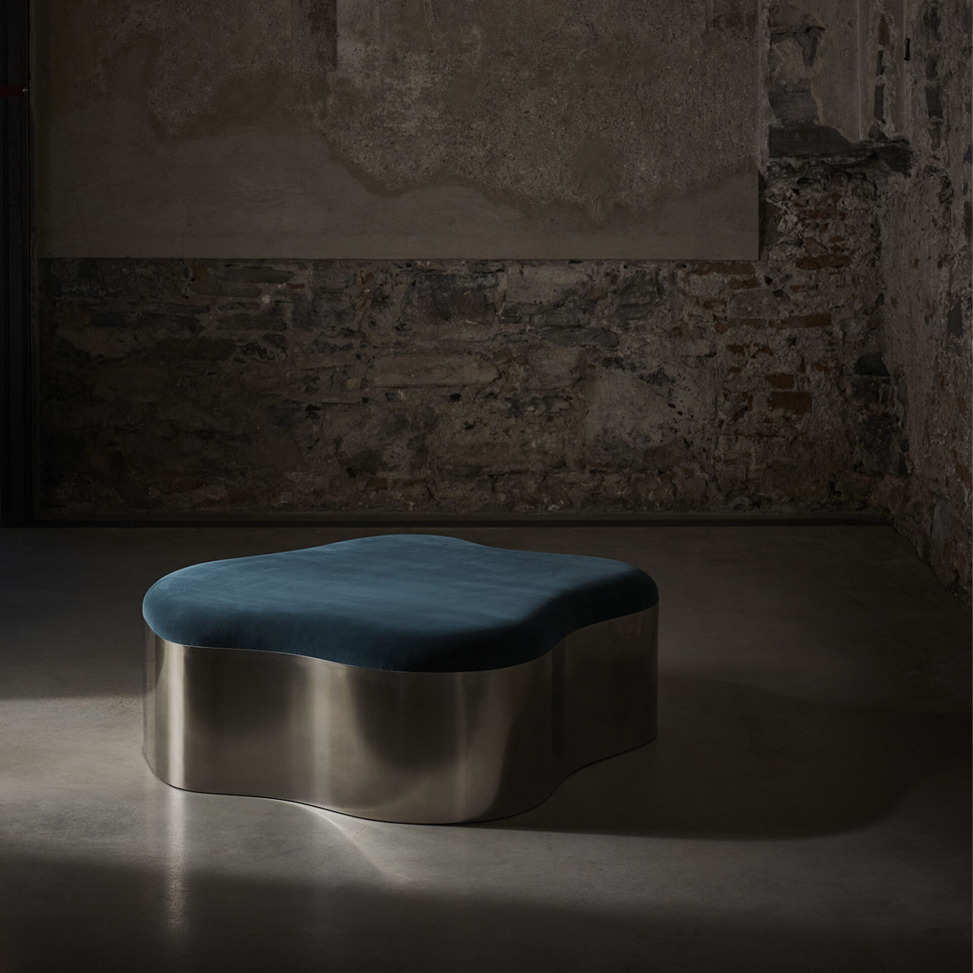 Lily ottoman in polished stainless steel and COM 