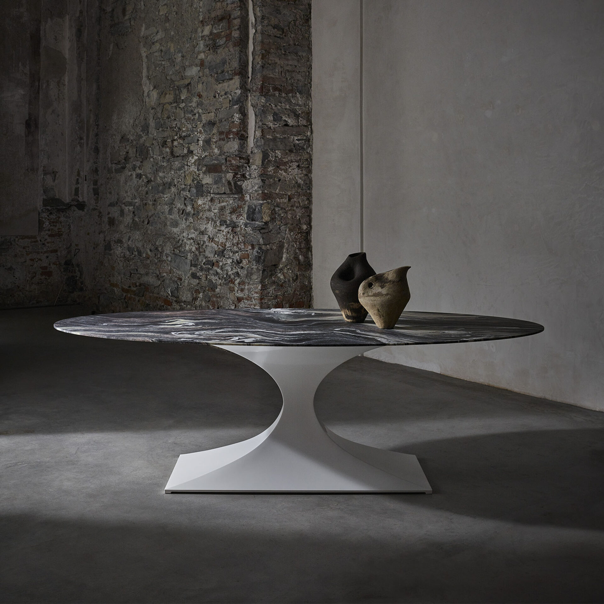 Capricorn oval dining table in white with Rosso Luana Verde marble top detail