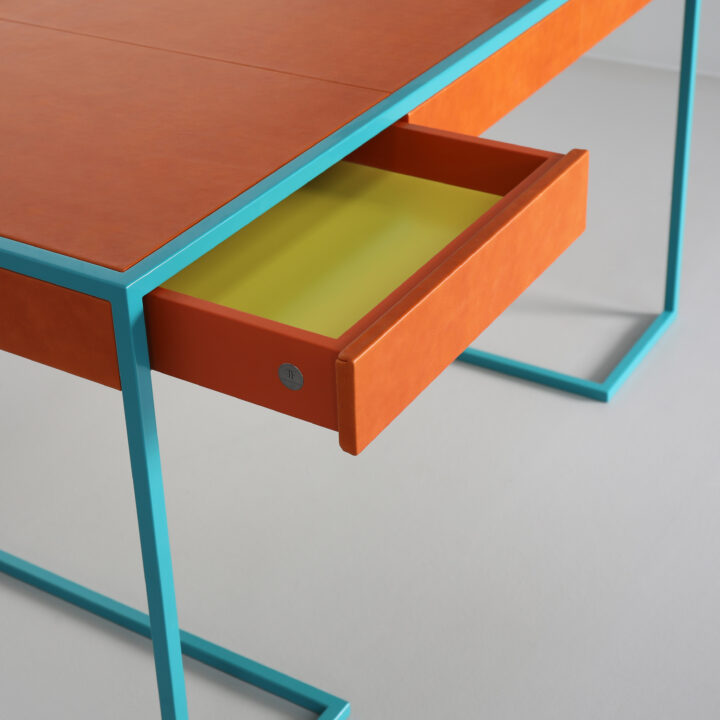Finished in "Teal" with "Pumpkin" leather