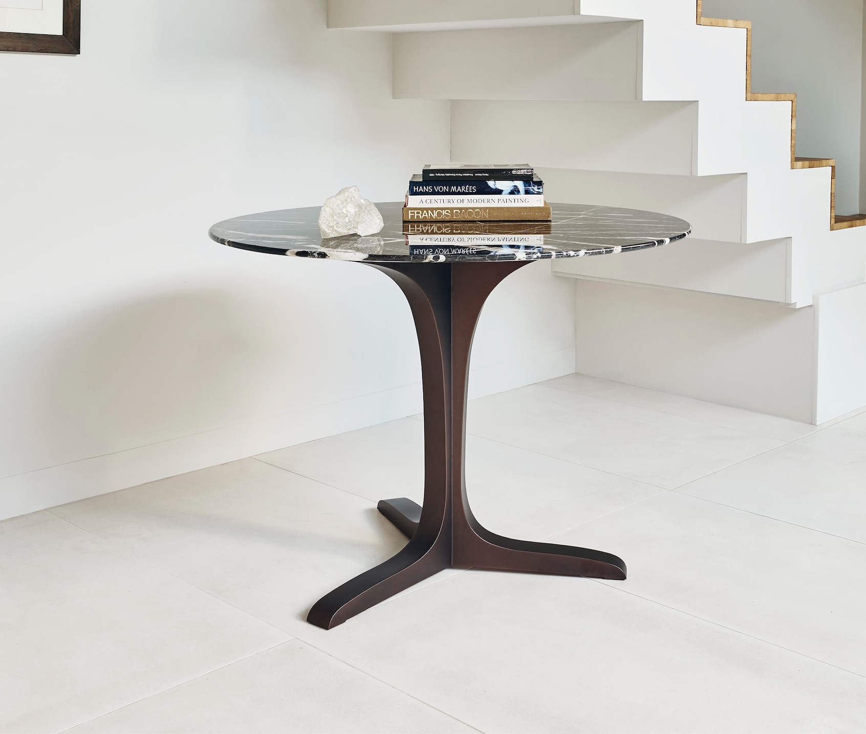 Angel Round Dining Table in Bronze with a Noir St Laurent marble top