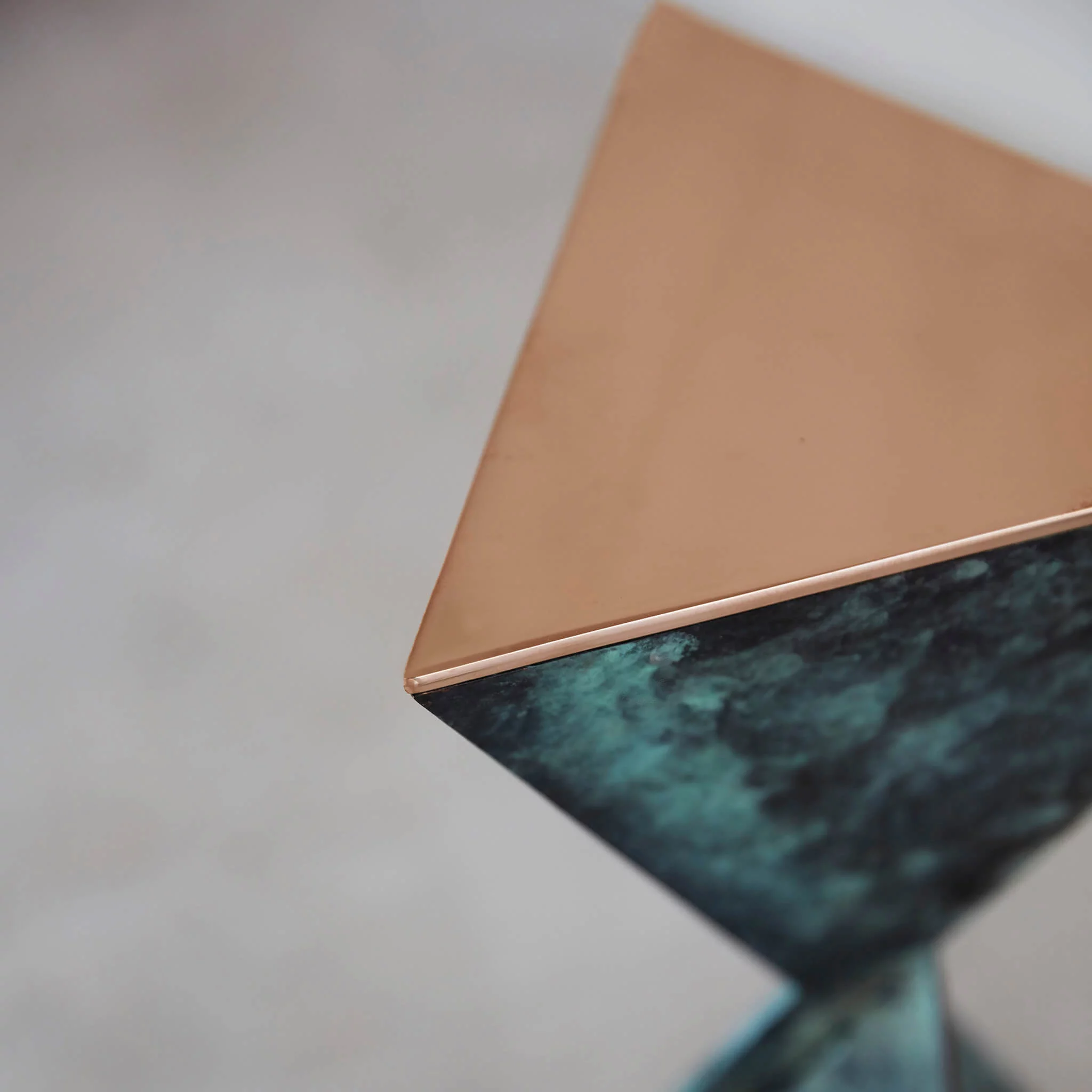 Made in bronze with a "Bottle Green" patination with polished bronze top plates