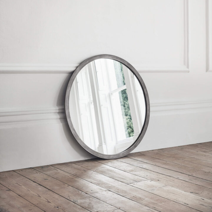 Madison round metal mirror by Tom Faulkner
