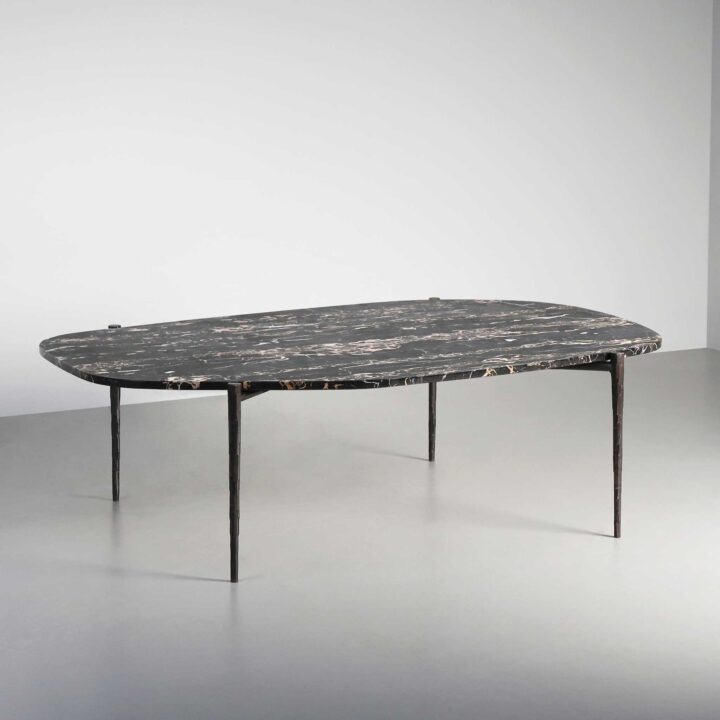 Hammered Bronze legs with a rich dark marble top