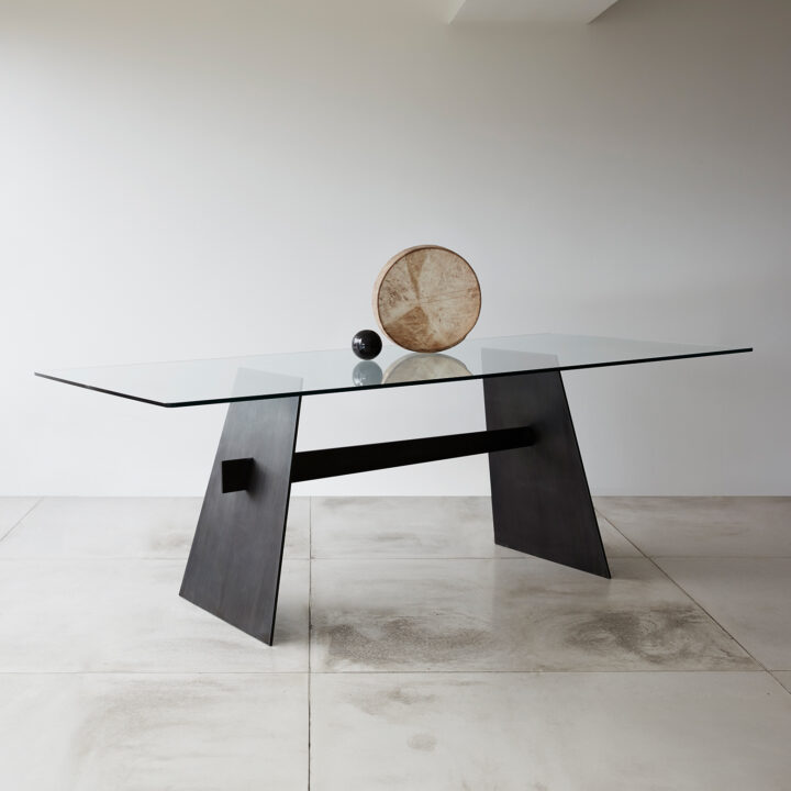 Made in steel finished in "Black" patina with clear glass top 