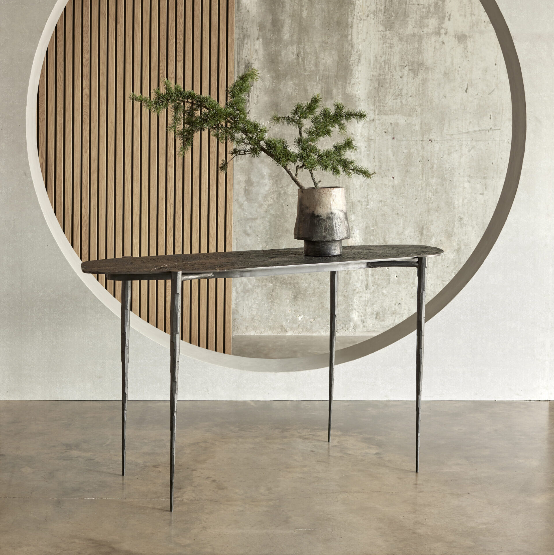 Cloud console with a ‘Kintsugi’ Moon top and hammered steel legs