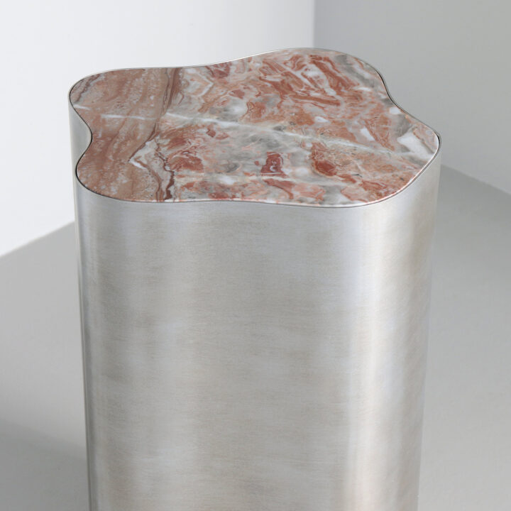 Finished in "Persian Silver" with a Rosso Oribico marble top