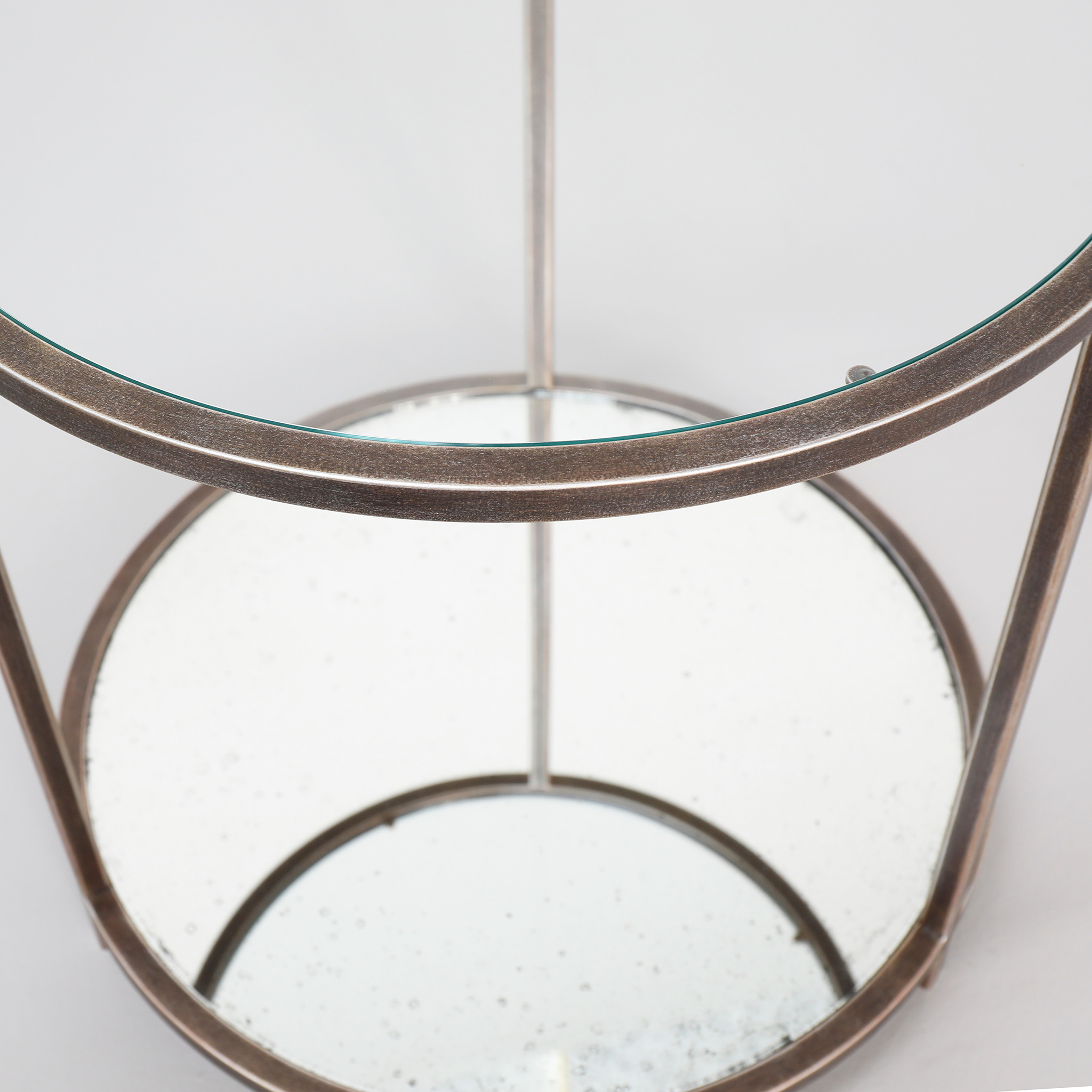Finished in "Rose Pewter" with a clear glass top and antique mirror shelf