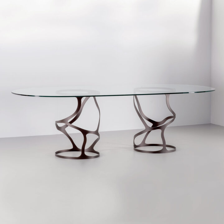 Finished in "Bronze" with a clear glass top