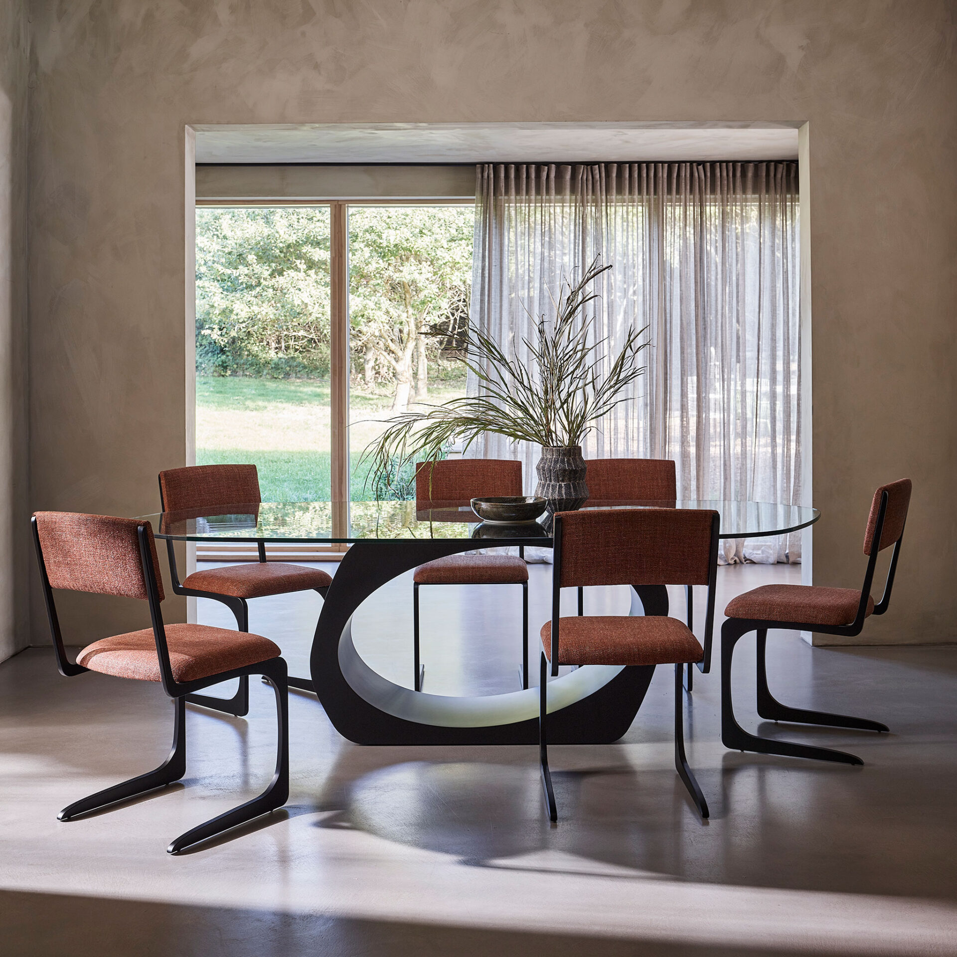 Skye dining table and Angel side chairs, finished in matt black