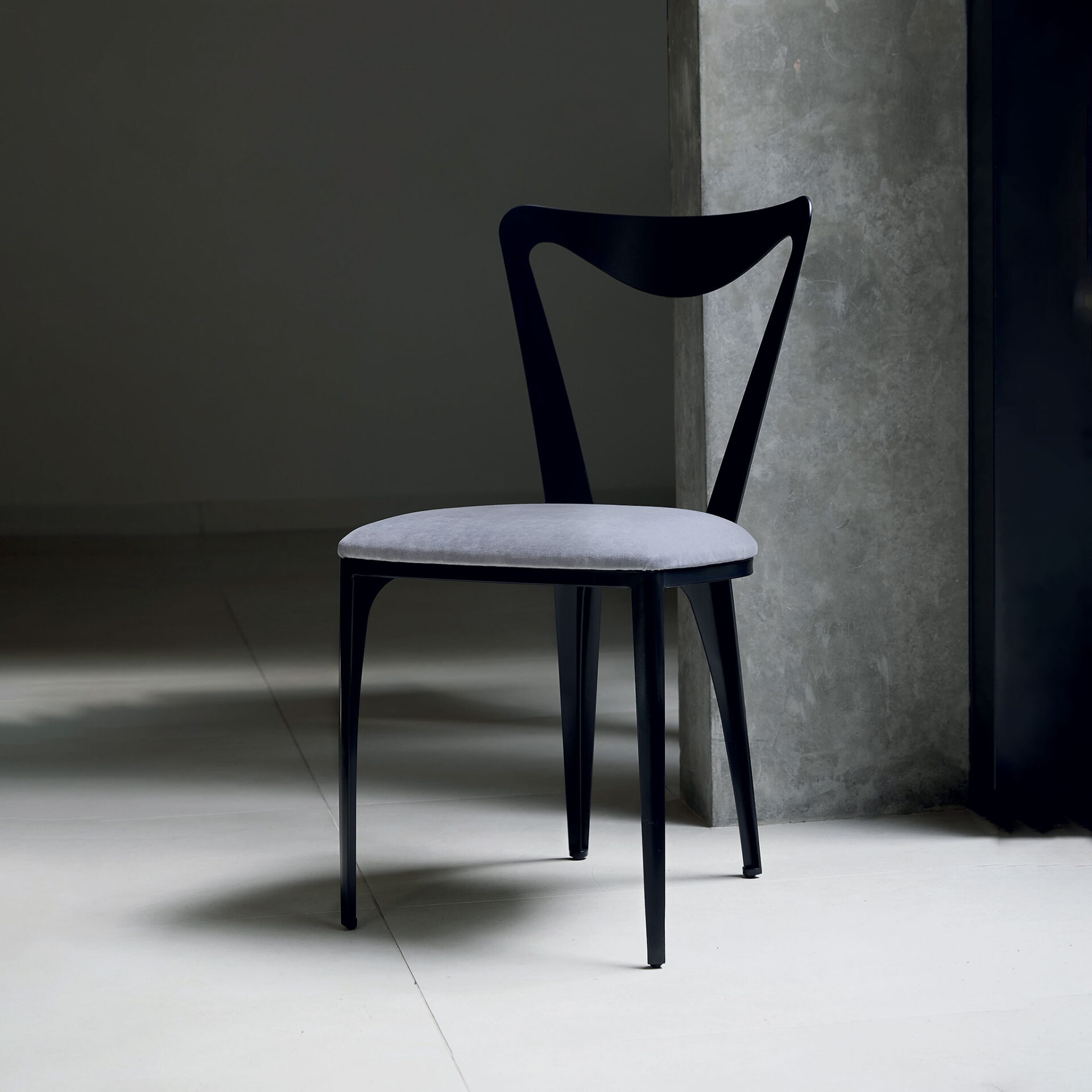 Finished in "Charcoal" upholstered in COM
