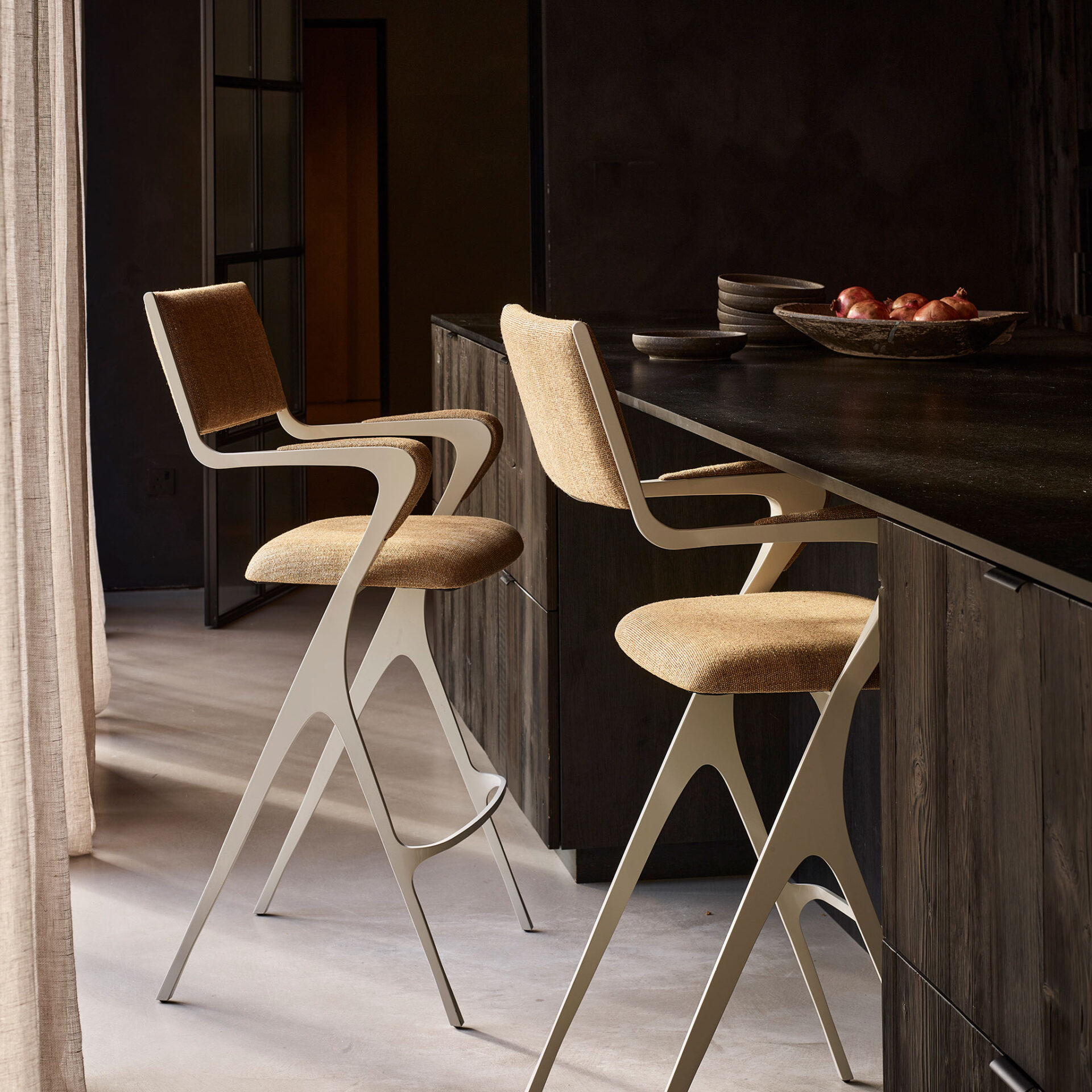 Vienna bar stools finished in Stone Grey with C.O.M. fabric