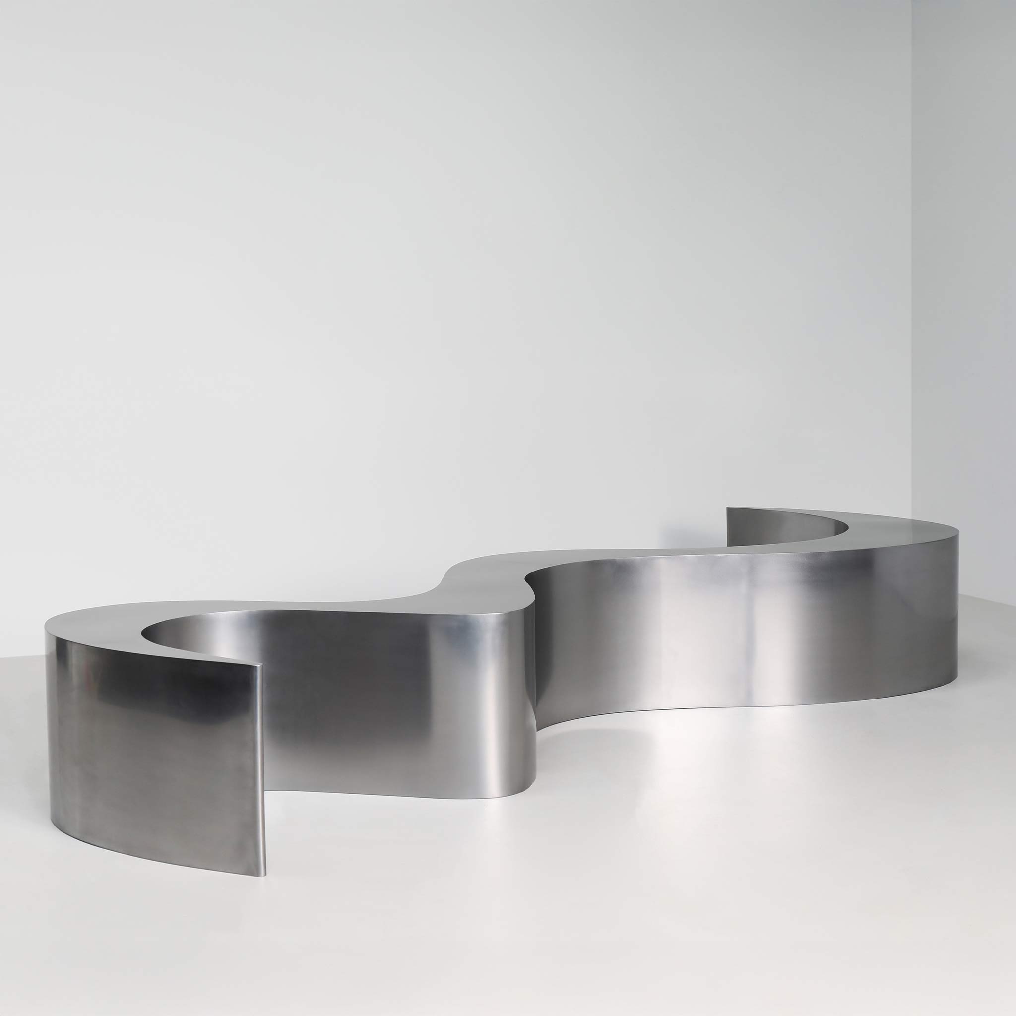 Wave bench in polished stainless steel