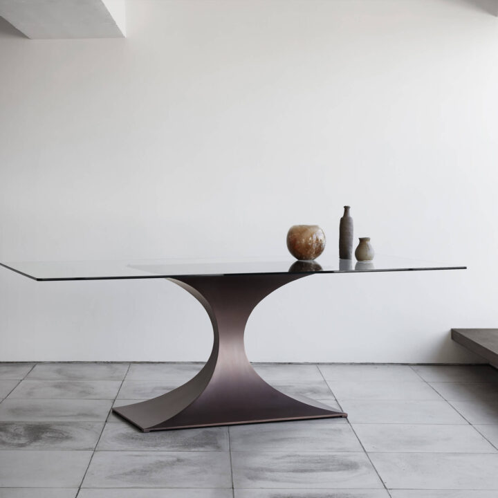 Finished in "Bronze" with a clear glass top