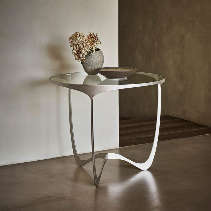 Circular metal side table by Tom Faulkner