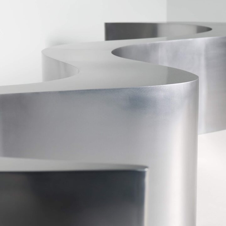 Wave bench in polished stainless steel